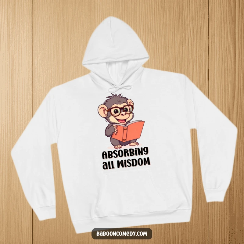 Warm funny hoodie featuring a giggling baboon wearing oversized glasses, deeply engrossed in a large book, perfect for cozy reading.