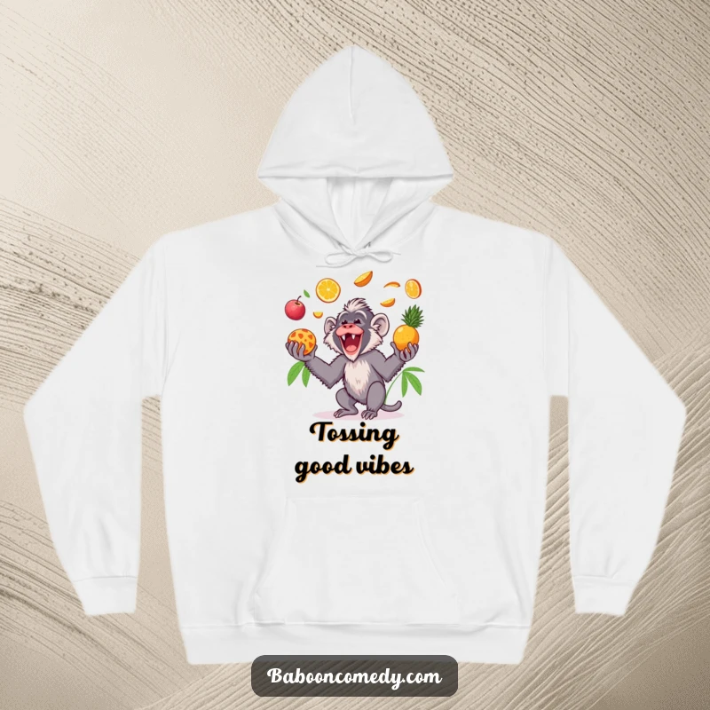 Funny Kawaii baboon hoodie, showing a gleeful primate tossing colorful tropical fruits in the air and catching them with pure delight.