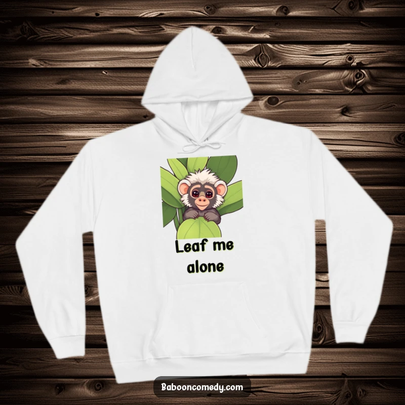 Funny Kawaii Baboon Hoodie, featuring a cute baboon peeking mischievously from behind a large, leafy plant.