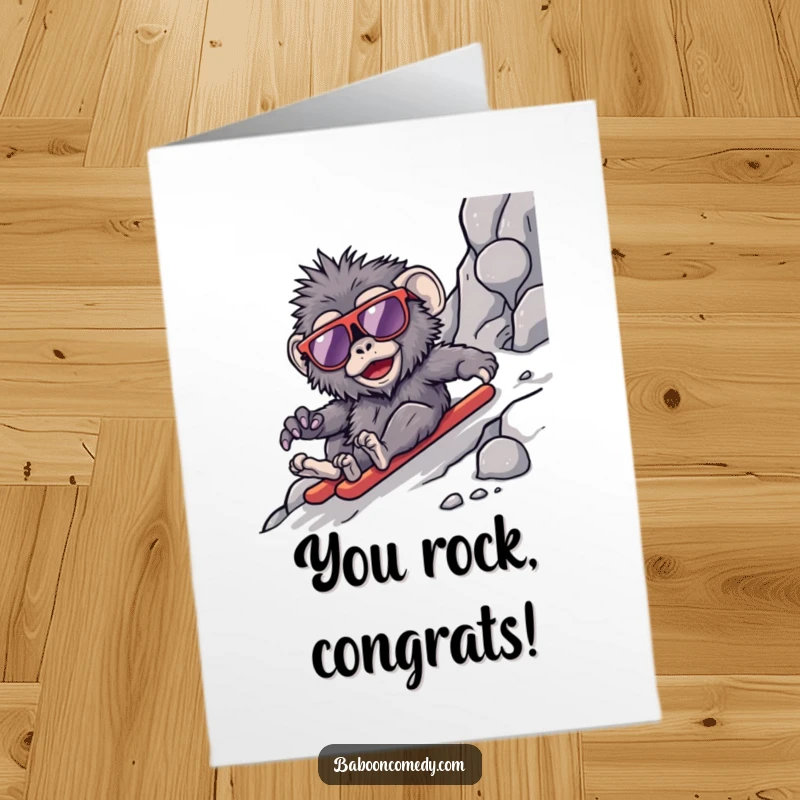 Funny Free Printable Congrats Card: A kawaii baboon wearing cool sunglasses, making a stylish slide down a rocky slope.